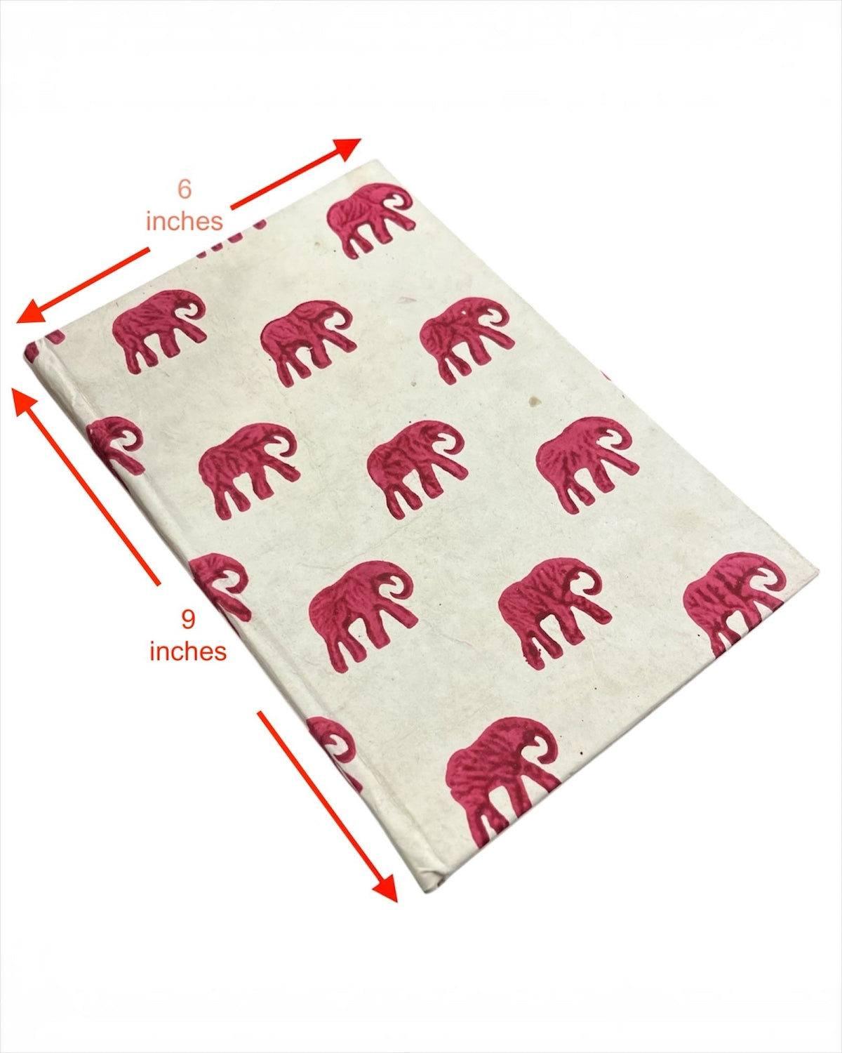 Bombay Paperie handcrafted 6x9 inch notebook featuring a cream cover with vibrant pink block-printed elephant motifs.