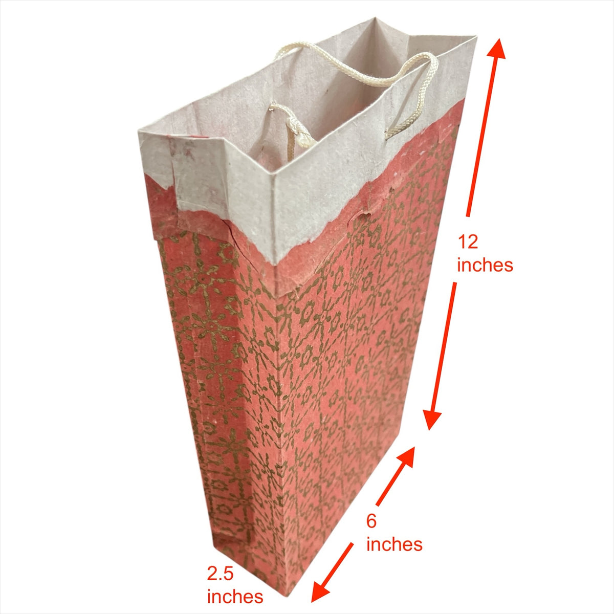 Bombay Paperie handmade paper gift bag in red and pink with gold-foiled patterns and deckled-edge top